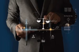 Man in a suit holding a tablet